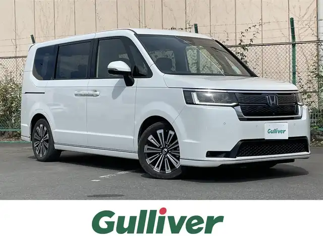 ホンダ ステップワゴン スパーダ eHEV プレミアムライン 東京都 2023(令5)年 3.1万km プラチナホワイトパール 純正11.4型ホンダコネクトナビ＆地デジ/・BluetoothＡｕｄｉｏ/USB/・AppleCarPlay＆AndroidAuto/・ＣＤ/DVD再生可/ＬＥＤヘッドライト/マルチビューカメラ/ホンダセンシング/（安全運転支援システム）/・衝突軽減ブレーキ/・後方誤発進抑制機能/・歩行者事故低減ステアリング/・渋滞追従機能付きアダプティブクルーズコントロール/・車線維持支援システム/・先行車発進お知らせ機能/・オートハイビーム/・誤発進抑制機能/・近距離衝突軽減ブレーキ/・路外逸脱抑制機能/・標識認識機能/ブラインドスポット/パーキングセンサー/シートヒーター/両側電動スライドドア/パワーバックドア/ETC/スマートキー