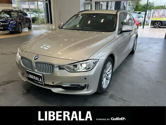 ＢＭＷ ３２０ｉ ツーリング 大阪府 2014(平26)年 5.9万km ゴールド 純正ナビ/バックカメラ/純正17インチAW/HIDヘッドライト/クリアランスソナー/ルーフレール/ハーフ革/パワーシート/Dシートメモリ/クルコン