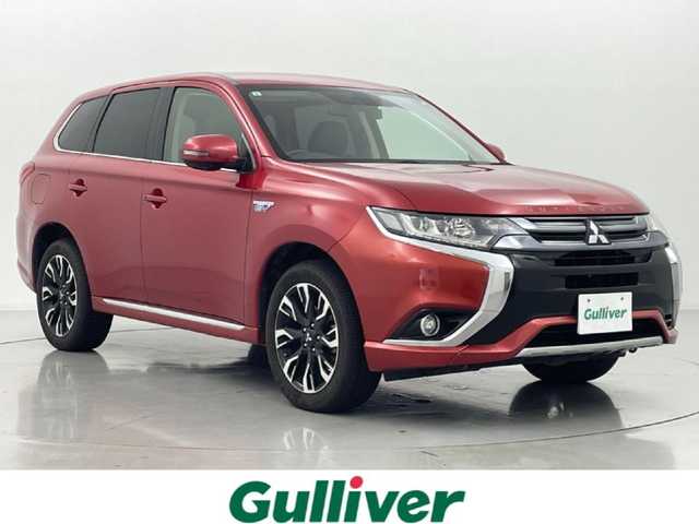 三菱 アウトランダー ＰＨＥＶ G セーフティパッケージ 熊本県 2015(平27)年 9.9万km レッドメタリック 禁煙車　/社外ナビ（ＣＤ・ＤＶＤ・フルセグ・ＢＴ・ＳＤ・ＵＳＢ）/全周囲カメラ　/社外前方ドライブレコーダー　/ＥＴＣ　/レーダークルーズコントロール　/前席シートヒーター　/運転席パワーシート　/衝突軽減ブレーキ/レーンキープアシスト/横滑り防止/ハーフレザーシート/純正フロアマット/純正１８インチAW/オートライト/LEDヘッドライト/フォグライト/スマートキー/プッシュスタート/保証書/取扱説明書
