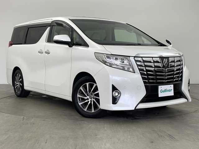トヨタ アルファード G 兵庫県 2016(平28)年 7.8万km ホワイトパールクリスタルシャイン ・社外10インチナビ/CD/DVD/TV/SD/・社外リアフリップダウンモニター/・バックカメラ　/・プリクラッシュセーフティ/・レーダークルーズコントロール/・クリアランスソナー/・ECO MODE/・前後ドライブレコーダー/・ツインムーンルーフ/・両側パワースライドドア/・パワーバックドア/・ビルトインETC/・運転席メモリー機能付きパワーシート/・前席パワーシート/・オットマン/・nanoe/・LEDヘッドライト/・オートライト/・フォグランプ/・ウィンカーミラー/・オートワイパー/・ウォークスルー/・純正フロアマット/・純正１７インチアルミホイール/・社外レーダー/・社外革調シートカバー/・ドアバイザー/・オールオートパワーウィンドウ/・電動格納ミラー/・スマートキー/・スペアキー
