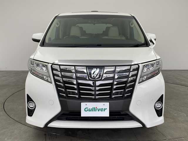 トヨタ アルファード G 兵庫県 2016(平28)年 7.8万km ホワイトパールクリスタルシャイン ・社外10インチナビ/CD/DVD/TV/SD/・社外リアフリップダウンモニター/・バックカメラ　/・プリクラッシュセーフティ/・レーダークルーズコントロール/・クリアランスソナー/・ECO MODE/・前後ドライブレコーダー/・ツインムーンルーフ/・両側パワースライドドア/・パワーバックドア/・ビルトインETC/・運転席メモリー機能付きパワーシート/・前席パワーシート/・オットマン/・nanoe/・LEDヘッドライト/・オートライト/・フォグランプ/・ウィンカーミラー/・オートワイパー/・ウォークスルー/・純正フロアマット/・純正１７インチアルミホイール/・社外レーダー/・社外革調シートカバー/・ドアバイザー/・オールオートパワーウィンドウ/・電動格納ミラー/・スマートキー/・スペアキー