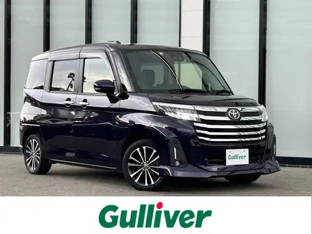 トヨタ ルーミー カスタムG－T 大阪府 2021(令3)年 2.1万km クールバイオレットクリスタルシャイン 純正9インチナビ/・フルセグTV/USB/BT/DVD/HDMI/パノラミックビューモニター/両側パワースライドドア/前後ドライブレコーダー/F席シートヒーター/ビルトインETC/純正フロアマット/純正15インチAW/LEDヘッド・フォグ/シートカバー付/保証書/スペアキー/アダプティブクルーズ/パーキングシステム/衝突軽減システム/アイドリングストップ