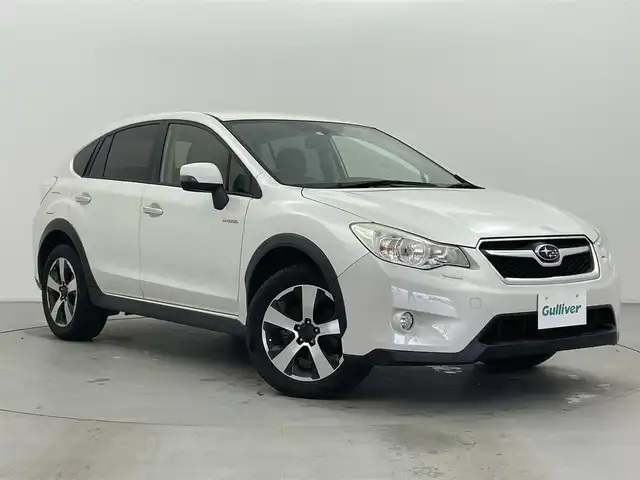 スバル インプレッサ ＸＶ ハイブリッド 2．0i－L 富山県 2014(平26)年 3.8万km サテンホワイトパール 4WD/社外ナビ(AM/FM/BT/CD/DVD)/フルセグTV/クルーズコントロール/衝突軽減ブレーキ/横滑り防止装置/オートライト/ヘッドライトウォッシャー/社外フロアマット/純正AW/ETC/キセノンヘッドライト/スマートキー/スペアキー1本/プッシュスタート/電動格納ミラー/バニティミラー/取扱説明書/保証書