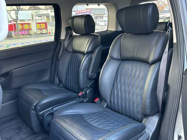 日産 エルグランド オーテック 福岡県 2024(令6)年 1.2万km ピュアホワイトパール 【ワンオーナー】/純正ナビ/iPod/SD/AM/FM/Bluetooth・CD/DVD/MusicStccker・HDMI/ETC(ビルド/ドライブレコーダー/純正フロアマット/クルーズコントロール/パワーシート（D.N)/オートライト/横滑り防止/電動格納ミラー/フリップダウンモニター/プッシュスタート/シートヒーター（D.N)/フォグランプ/Pスライドドア（両方）/電動リアゲート