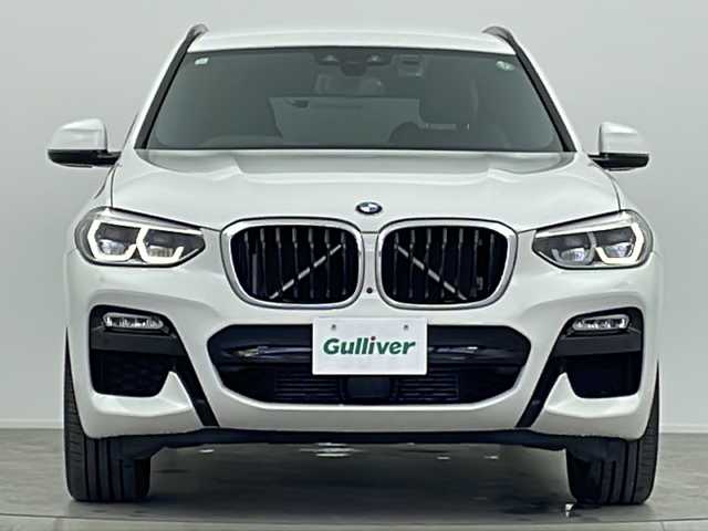 ＢＭＷ Ｘ３ xDrive20d Mスポーツ 大阪府 2018(平30)年 5.5万km アルピンホワイトⅢ 10.25インチワイド・コントロール・ディスプレイ/(フルセグTV/AM/FM/CD/DVD/USB/BT)/ヘッドアップディスプレイ/ブラインドスポットモニター/ドライブレコーダー/ETC/パーキング・アシスト・プラス/・パーク・ディスタンス・コントロール/・パーキング・アシスト/・トップ・ビュー/・サイド・ビュー・カメラ/・リヤ・ビュー・カメラ/ドライビング・アシスト・プラス/・アクティブ・クルーズ・コントロール/・ステアリング＆レーン・コントロール・アシスト/・レーン・ディパチャー・ウォーニング(車線逸脱警告システム)/・レーン・チェンジ・ウォーニング/・アクティブ・サイド・コリジョン・プロテクション/・全車接近警告機能/・衝突回避・被害軽減ブレーキ/・事故回避アシスト/・後車衝突警告機能/・クロス・トラフィック・ウォーニング(フロント＆リア)/ブラインドスポットモニター/オートホールド/パドルシフト/パワーバックドア/メモリシート/シートヒーター/シートメモリ/レザーシート/ルーフレール/スペアキー/取扱説明書/保証書/記録簿(R1.10/R2.11/R3.11/R5.11/R6.11)