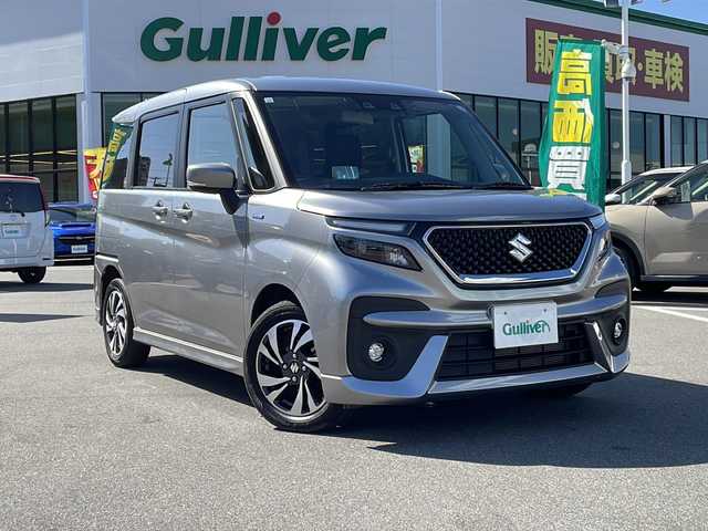 スズキ ソリオ バンディット HV MV 長野県 2023(令5)年 1.9万km プレミアムシルバーメタリック セーフティサポート/・デュアルセンサーブレーキサポート/・アダプティブクルーズコントロール/・リアパーキングセンサー/・車線逸脱警報機能/・車線逸脱抑制機能/・ハイビームアシスト/社外ナビ【AVN-LS02】/（CD/DVD/フルセグTV/Bluetooth）/ETC/シートヒーター（D・N席）/両側パワースライドドア/革巻きステアリング/ステアリングスイッチ/ヘッドアップディスプレイ/アイドリングストップ/LEDヘッドライト/フォグランプ/オートライト/スマートキー/Pスタート/電動格納ミラー/純正フロアマット/純正15インチAW