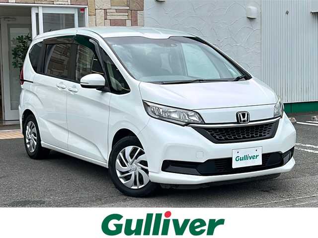 ホンダ フリード G ホンダセンシング 徳島県 2020(令2)年 5.8万km プラチナホワイトパール ・社外ナビ/・Bカメラ/・ETC/・フルセグTV/・クルコン/・CD/DVD/・Bluetooth/・両側パワースライドドア/・ウォークスルー/・３列シート/・LEDヘッドライト/・オートライト/・純正フロアマット