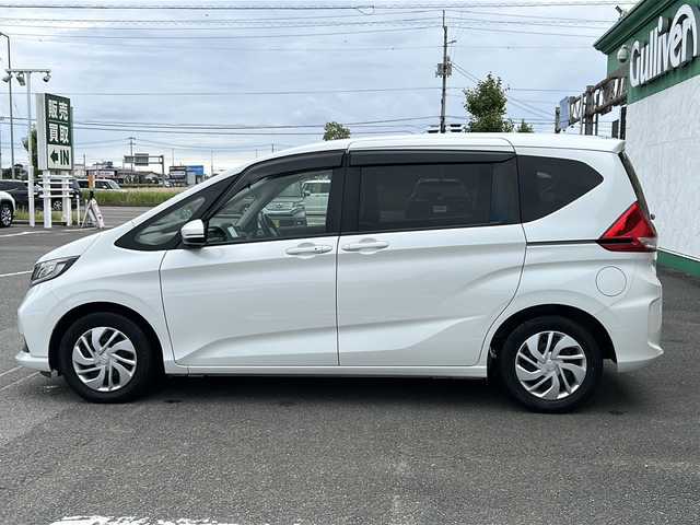 ホンダ フリード G ホンダセンシング 徳島県 2020(令2)年 5.8万km プラチナホワイトパール ・社外ナビ/・Bカメラ/・ETC/・フルセグTV/・クルコン/・CD/DVD/・Bluetooth/・両側パワースライドドア/・ウォークスルー/・３列シート/・LEDヘッドライト/・オートライト/・純正フロアマット