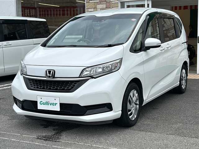 ホンダ フリード G ホンダセンシング 徳島県 2020(令2)年 5.8万km プラチナホワイトパール ・社外ナビ/・Bカメラ/・ETC/・フルセグTV/・クルコン/・CD/DVD/・Bluetooth/・両側パワースライドドア/・ウォークスルー/・３列シート/・LEDヘッドライト/・オートライト/・純正フロアマット
