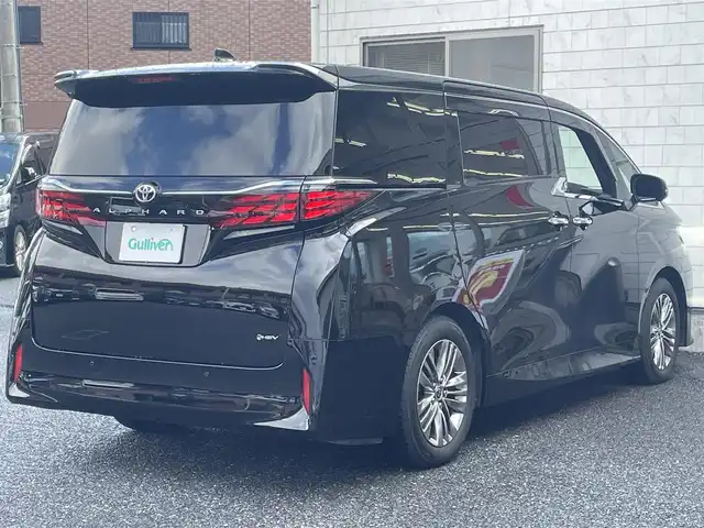 トヨタ アルファードハイブリット Z 福岡県 2024(令6)年 1万km ブラック ワンオーナー/ツインムーンルーフ/純正14インチコネクテッドナビ/　(Bluetooth/Miracast/フルセグTV)/パノラミックビューモニター/バックカメラ/デジタルインナーミラー/アドバンストパーク/アドバンストドライブ/トヨタセーフティセンス/・プリクラッシュセーフティ/・レーンディパーチャーアラート/・ロードサインアシスト/・レーダークルーズコントロール/・オートマチックハイビーム/ブラインドスポットモニター/安心降車アシスト/後方車両接近告知/周辺車両接近時サポート/クリアランスソナー/プロアクティブドライビングアシスト/フロント/リヤクロストラフィックアラート/リヤカメラディテクション/パーキングサポートブレーキ/両側パワースライドドア/パワーバックドア/純正18インチアルミホール/黒レザーシート/パドルシフト/ステアリングヒーター/パワーシート/シートヒーター/ベンチレーション/シートメモリー/電動サンシェード(2.3列目)/前後ドライブレコーダー/ETC2.0/純正フロアマット/置くだけ充電/スペアタイヤ/USBタイプCポート/100V電源