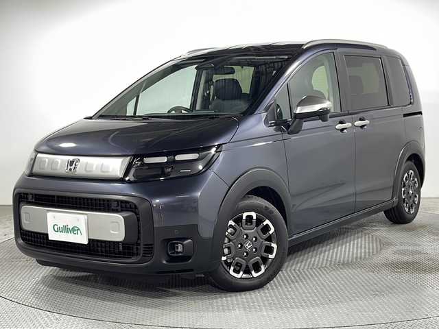 ホンダ フリード ハイブリット e:HEV クロスター 広島県 2025(令7)年 0.1千km メテオロイドグレーメタリック 登録済未使用車　5Km/純正９型ナビ/バックカメラ/シートヒーター/両側パワースライドドア/レーダークルーズコントロール/オートマチックハイビーム/衝突被害軽減ブレーキ/レーンキープアシスト/踏み間違い防止/ブラインドスポットモニター/ホールド機能付電動パーキングブレーキ/コーナーセンサー/LEDヘッドライト/純正15インチアルミホイール(185/65/R15)/エアバッグ(運転席/助手席/サイド/カーテン)