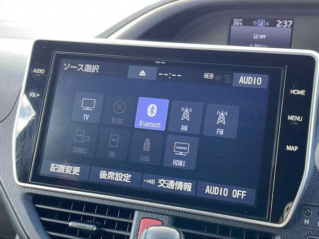 トヨタ ヴォクシー ZS 煌Ⅱ 福岡県 2020(令2)年 4.9万km ブラック 純正10インチナビ/（Bカメラ、Bluetooth、CD、DVD、TV、USB、HDMI、AM、FM）/両側パワースライドドア/純正12.1インチフリップダウンモニター（V12T-R68C)/デュアルエアコン/リアエアコン/クルーズコントロール/ドライブレコーダー前後/ETC/純正16インチホイール/プリクラッシュ/横滑り防止装置/車線逸脱警報/クリアランスソナー/アイドリングストップ/オートマチックハイビーム/プッシュスタート/スマートキー/LEDヘッドライト/フォグランプ/保証書