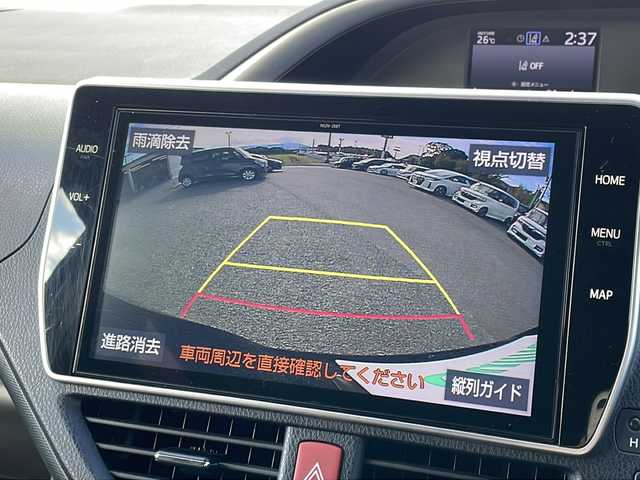 トヨタ ヴォクシー ZS 煌Ⅱ 福岡県 2020(令2)年 4.9万km ブラック 純正10インチナビ/（Bカメラ、Bluetooth、CD、DVD、TV、USB、HDMI、AM、FM）/両側パワースライドドア/純正12.1インチフリップダウンモニター（V12T-R68C)/デュアルエアコン/リアエアコン/クルーズコントロール/ドライブレコーダー前後/ETC/純正16インチホイール/プリクラッシュ/横滑り防止装置/車線逸脱警報/クリアランスソナー/アイドリングストップ/オートマチックハイビーム/プッシュスタート/スマートキー/LEDヘッドライト/フォグランプ/保証書