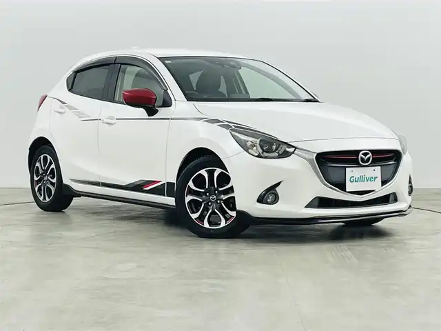 マツダ デミオ XD ブラックレザーリミテッド 福島県 2016(平28)年 6.6万km スノーフレイクホワイトパールマイカ 衝突軽減/・車線逸脱警報/・オートマチックハイビーム/・GVC/純正エアロ（フロント サイド）/純正7インチディスプレイオーディオ/・フルセグ/TV/BT/USB/AUX/SD/CD/DVD/FM/AM/バックカメラ/クルーズコントロール/LEDオートライト/・フォグライト/ハーフレザー/・シートヒーター/純正アルミホイール付きサマータイヤ/革ステアリング/・ステアリングリモコン/・パドルシフト/アイドリングストップ/純正フロアマット/純正ドアバイザー/アイドリングストップ/電動格納ミラー/・ウィンカーミラー/MTモード付AT/プッシュスタート/・スマートキー