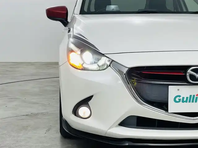 マツダ デミオ XD ブラックレザーリミテッド 福島県 2016(平28)年 6.6万km スノーフレイクホワイトパールマイカ 衝突軽減/・車線逸脱警報/・オートマチックハイビーム/・GVC/純正エアロ（フロント サイド）/純正7インチディスプレイオーディオ/・フルセグ/TV/BT/USB/AUX/SD/CD/DVD/FM/AM/バックカメラ/クルーズコントロール/LEDオートライト/・フォグライト/ハーフレザー/・シートヒーター/純正アルミホイール付きサマータイヤ/革ステアリング/・ステアリングリモコン/・パドルシフト/アイドリングストップ/純正フロアマット/純正ドアバイザー/アイドリングストップ/電動格納ミラー/・ウィンカーミラー/MTモード付AT/プッシュスタート/・スマートキー