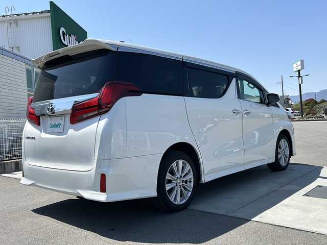 トヨタ アルファード S 山梨県 2023(令5)年 1.8万km ホワイトパールクリスタルシャイン ディスプレイオーディオ/バックカメラ/両側パワースライドドア/ETC/クルーズコントロール/禁煙車/LEDヘッドライト/Bluetooth再生/純正１８インチアルミ/衝突軽減システム/オートマチックハイビーム/コーナーセンサー/スペアキー/フリップダウンモニター
