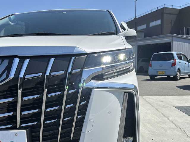 トヨタ アルファード S 山梨県 2023(令5)年 1.8万km ホワイトパールクリスタルシャイン ディスプレイオーディオ/バックカメラ/両側パワースライドドア/ETC/クルーズコントロール/禁煙車/LEDヘッドライト/Bluetooth再生/純正１８インチアルミ/衝突軽減システム/オートマチックハイビーム/コーナーセンサー/スペアキー/フリップダウンモニター