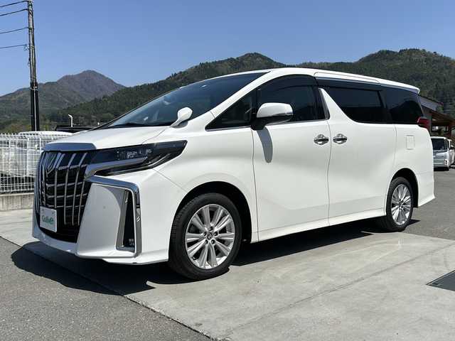 トヨタ アルファード S 山梨県 2023(令5)年 1.8万km ホワイトパールクリスタルシャイン ディスプレイオーディオ/バックカメラ/両側パワースライドドア/ETC/クルーズコントロール/禁煙車/LEDヘッドライト/Bluetooth再生/純正１８インチアルミ/衝突軽減システム/オートマチックハイビーム/コーナーセンサー/スペアキー/フリップダウンモニター