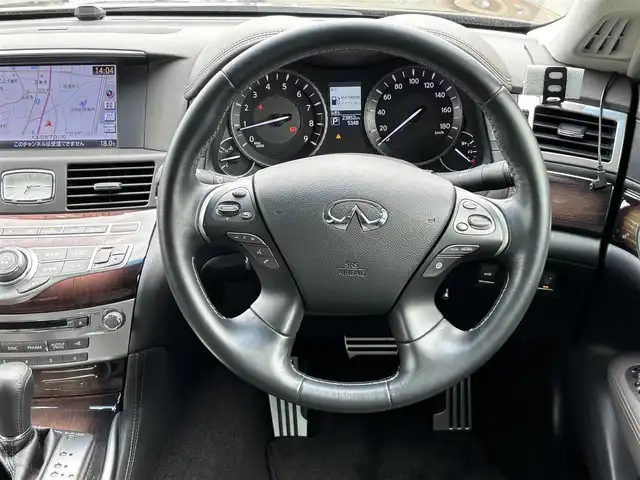 日産 フーガ 370GT FOUR 福岡県 2015(平27)年 2.4万km ブラックパール 〇純正ナビ/〇フルセグTV/〇ETC/〇ドライブレコーダー/〇プレミアムインテリアパッケージ/〇ブラウンセミアニリン革シート/〇インテリジェントクルーズコントロール/〇全方位運転支援システム/〇LEDヘッドランプ/〇オートライト/〇純正18インチアルミホイール/〇純正フロアマット/〇革巻きステアリングホイール/〇SRSエアバッグ/〇フォレストエアコン/〇パワーシート/パワーオットマン(助手席)/〇アームレスト/〇インテリジェントキー/アラウンドビューモニター/〇スペアキー/〇禁煙車