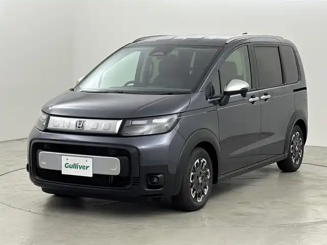 ホンダ フリード ハイブリット e:HEV クロスター 福岡県 2025(令7)年 0.1千km メテオロイドグレーメタリック 登録済未使用車　/純正９型ナビ／フルセグＴＶ／ＢＴ　/両側パワースライドドア　/バックカメラ　/レーダークルーズコントロール　/ＢＳＭ　/衝突軽減被害システム　/レーンキープ　/コーナーセンサー　/シートヒーター