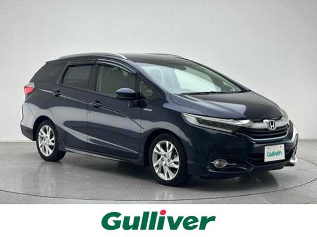 ホンダ シャトル ハイブリッド Z 兵庫県 2015(平27)年 3.2万km ミッドナイトブルービームM 純正SDナビ(CD/DVD/Bluetooth/フルセグ)/バックカメラ/パドルシフト/クルーズコントロール/ハーフレザーシート/シートヒーター/LEDヘッドライト/オートライト/フォグライト/純正16インチアルミホイール/純正フロアマット/ETC