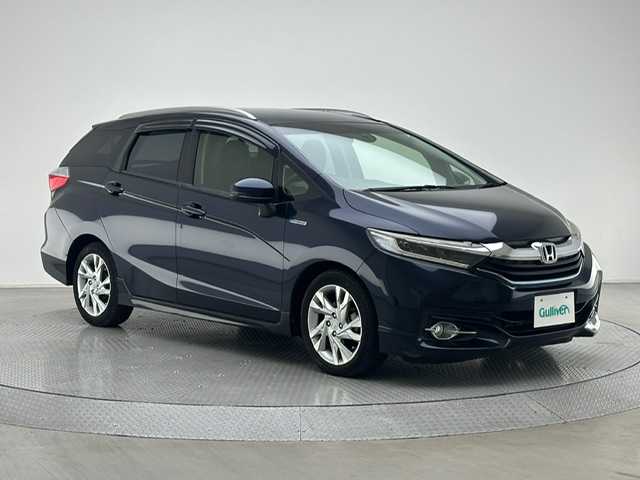 ホンダ シャトル ハイブリッド Z 兵庫県 2015(平27)年 3.2万km ミッドナイトブルービームM 純正SDナビ(CD/DVD/Bluetooth/フルセグ)/バックカメラ/パドルシフト/クルーズコントロール/ハーフレザーシート/シートヒーター/LEDヘッドライト/オートライト/フォグライト/純正16インチアルミホイール/純正フロアマット/ETC