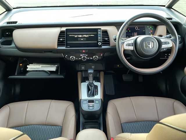 ホンダ フィット e:HEVリュクス 新潟県 2020(令2)年 2.4万km プレミアムグラマラスブロンズP 純正9インチナビ/バックカメラ/置くだけ充電/Blueooth/USB/プッシュスタート/スマートキー/ETC/ホンダエセンシング/シートヒーター/LEDヘッドライト/ハーフレザー/前後ドラレコ/純正フロアマット/純正アルミホイール