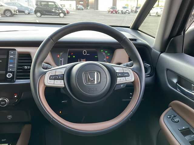 ホンダ フィット e:HEVリュクス 新潟県 2020(令2)年 2.4万km プレミアムグラマラスブロンズP 純正9インチナビ/バックカメラ/置くだけ充電/Blueooth/USB/プッシュスタート/スマートキー/ETC/ホンダエセンシング/シートヒーター/LEDヘッドライト/ハーフレザー/前後ドラレコ/純正フロアマット/純正アルミホイール