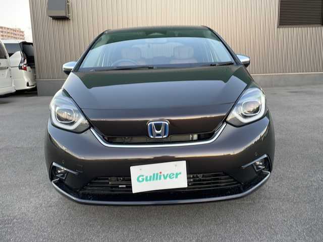 ホンダ フィット e:HEVリュクス 新潟県 2020(令2)年 2.4万km プレミアムグラマラスブロンズP 純正9インチナビ/バックカメラ/置くだけ充電/Blueooth/USB/プッシュスタート/スマートキー/ETC/ホンダエセンシング/シートヒーター/LEDヘッドライト/ハーフレザー/前後ドラレコ/純正フロアマット/純正アルミホイール