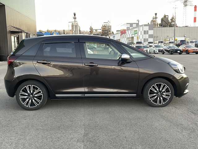 ホンダ フィット e:HEVリュクス 新潟県 2020(令2)年 2.4万km プレミアムグラマラスブロンズP 純正9インチナビ/バックカメラ/置くだけ充電/Blueooth/USB/プッシュスタート/スマートキー/ETC/ホンダエセンシング/シートヒーター/LEDヘッドライト/ハーフレザー/前後ドラレコ/純正フロアマット/純正アルミホイール