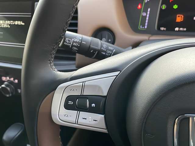 ホンダ フィット e:HEVリュクス 新潟県 2020(令2)年 2.4万km プレミアムグラマラスブロンズP 純正9インチナビ/バックカメラ/置くだけ充電/Blueooth/USB/プッシュスタート/スマートキー/ETC/ホンダエセンシング/シートヒーター/LEDヘッドライト/ハーフレザー/前後ドラレコ/純正フロアマット/純正アルミホイール