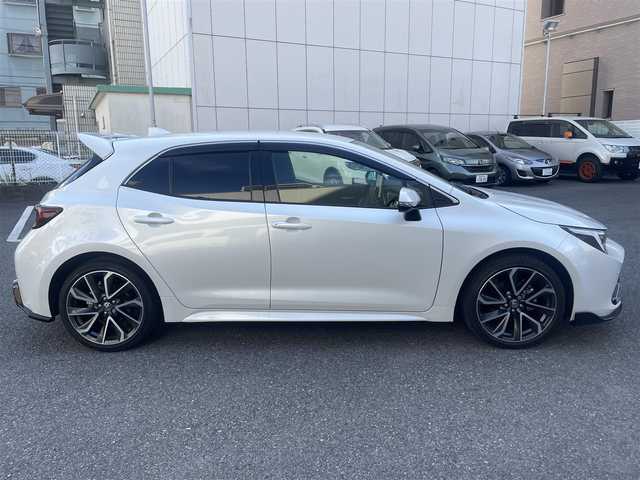 トヨタ カローラ スポーツ ハイブリッドG Z 神奈川県 2024(令6)年 0.8万km プラチナホワイトパールマイカ Toyota Safety Sense/・プリクラッシュセーフティ/・レーントレーシングアシスト/・レーンディパーチャーアラート/・プロアクティブドライビングアシスト/・オートマチックハイビーム/・ロードサインアシスト/・レーダークルーズコントロール/・発進遅れ告知機能/・ドライバー異常時対応システム/ブラインドスポットモニター/Tom’sエアロ/Tom’sマフラー/GRアルミペダル/純正ナビ＆フルセグTV/BT/タイプC/HDMI/バックカメラ/ビルトインETC2.0/前席シートヒーター/電動パーキングブレーキ/純正18inアルミホイール/オートライト/LEDライト/フォグランプ/オート電格ミラー/ウインカーミラー/スマートキー/プッシュスタート/W＆サイド＆カーテンエアバッグ/横滑り防止装置/ABS/ドアバイザー/保証書/取扱説明書/スペアキー