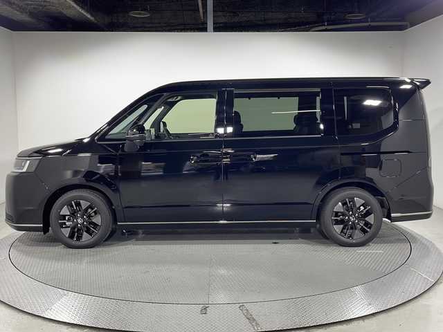 ホンダ ステップワゴン スパーダ eHEV 広島県 2025(令7)年 0.1万km未満 クリスタルブラックパール 登録済み未使用車/11.4インチナビHonda CONNECTナビ LXM-247VFLi/ホンダセンシング/追従クルーズコントロール/BSM/電動リアゲート/オットマン/シートヒーター/前後コーナーセンサー/バックカメラ/スペアキー/両側パワースライドドア/オートマチックハイビーム/減速セレクター/スマートキー