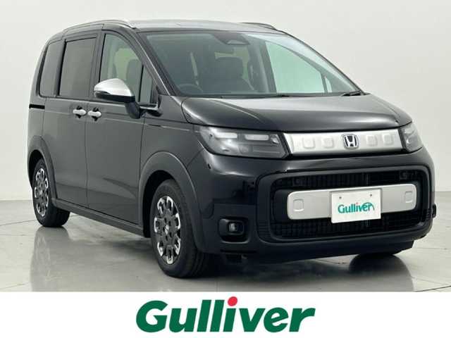 ホンダ フリード ハイブリット e:HEV クロスター 熊本県 2025(令7)年 0.1千km クリスタルブラックパール 登録済未使用車/純正9インチナビLXM-242ZFNI（ＡｐｐｌＣａｒＰｌａｙ・ＡｎｄｒｏｉｄＡｕｔｏ・ＢＴ・フルセグ・ＵＳＢ）/バックカメラ /ホンダセンシング/・レーダークルーズコントロール/・衝突軽減ブレーキ/・誤発進制御機能/後方誤発進抑制機能/・近距離衝突軽減ブレーキ/・歩行者事故低減ステアリング/・車線維持支援システム/・先行車発進お知らせ機能/・標識認識機能/横滑り防止/アイドリングストップ/ブラインドスポットモニター/パーキングアシスト/両側パワースライドドア　/前後クリアランスソナー　/前席シートヒーター/ブレーキホールド/電動パーキング/後席サーキュレーター/純正１５インチAW/オートライト/LEDヘッドライト/オートマチックハイビーム/フォグランプ/スマートキー/プッシュスタート/スペアキー1本/保証書/取扱説明書