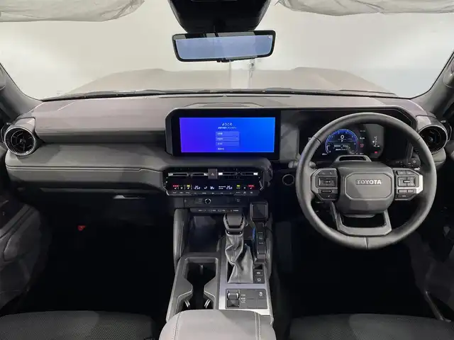 トヨタ ランドクルーザー ２５０ VX 愛知県 2025(令7)年 0.1万km アバンギャルドブロンズメタリック 純正１２．３インチディスプレイナビ　/(AM/FM/Bluetooth/Miracast/HDMI/フルセグTV/USB)/サンルーフ　/パノラミックビューモニター　/トヨタセーフティセンス　/　　-衝突軽減ブレーキ/　　-車線逸脱警報/　　-レーダークルーズコントロール/　　-オートマチックハイビーム/　　-ロードサインアシスト/　　-発進告知機能/シートヒーター　/シートベンチレーション/ビルトインＥＴＣ２．０　/デジタルインナーミラー　/ステアリングヒーター　/ブラインドスポットモニター/クリアランスソナー/D席パワーシート/ルーフレール　/三眼ＬＥＤヘッドライト/フォグランプ/黒レザーシート/純正フロアマット/スペアタイヤ有