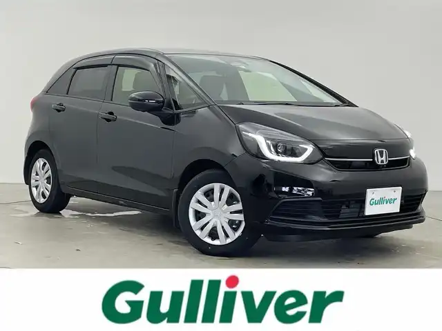 ホンダ フィット e:HEVホーム 富山県 2023(令5)年 0.7万km クリスタルブラックパール 純正ナビ（AM/FM/BT/USB/フルセグ）/全方位カメラ/ドライブレコーダー/ETC/ブラインドスポットモニター/ハーフレザーシート/衝突被害軽減システム/レーダークルーズコントロール/レーンキープアシスト/横滑り防止装置/アイドリングストップ/純正フロアマット/オートホールド付電子パーキング/革巻きステアリング/ステアリングスイッチ/スマートキー