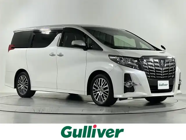 トヨタ アルファード S Cパッケージ 佐賀県 2016(平28)年 8.3万km ホワイトパールクリスタルシャイン 社外アルパイン製10インチナビ【EX10】/【フルセグTV.CD.DVD.Bluetooth】/社外アルパイン製12.8インチフリップダウンモニター/衝突被害軽減システム/レーダークルーズコントロール/レーンアシスト/カーテンエアバッグ/クリアランスソナー/オートライト/バックカメラ/前後ドライブレコーダー/両側パワースライドドア/パワーバッグドア/ステアリングヒーター/運転席・助手席パワーシート/ハーフレザーシート/純正18インチアルミホイール/LEDヘッドライト/フォグライト/禁煙車