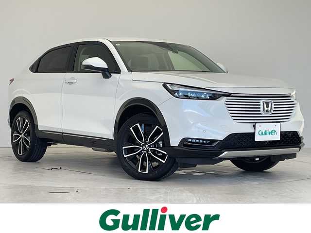 ホンダ ヴェゼル ハイブリッド e:HEV Z 愛知県 2024(令6)年 1.2万km プラチナホワイトパール 純正9型ナビ/レーダークルーズコントロール/シートヒーター/バックカメラ/電動リアゲート/コーナーセンサー/純正アルミホイール/ブラインドスポットモニター/LEDヘッドライト/パドルシフト/ステアリングヒーター/オートマチックハイビーム/ドライブレコーダー/ワイヤレス充電機/衝突軽減システム/フルセグ/Bluetooth/ステアリングスイッチ/スマートキー/プッシュスタート