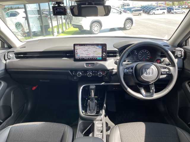 ホンダ ヴェゼル ハイブリッド e:HEV Z 愛知県 2024(令6)年 1.2万km プラチナホワイトパール 純正9型ナビ/レーダークルーズコントロール/シートヒーター/バックカメラ/電動リアゲート/コーナーセンサー/純正アルミホイール/ブラインドスポットモニター/LEDヘッドライト/パドルシフト/ステアリングヒーター/オートマチックハイビーム/ドライブレコーダー/ワイヤレス充電機/衝突軽減システム/フルセグ/Bluetooth/ステアリングスイッチ/スマートキー/プッシュスタート