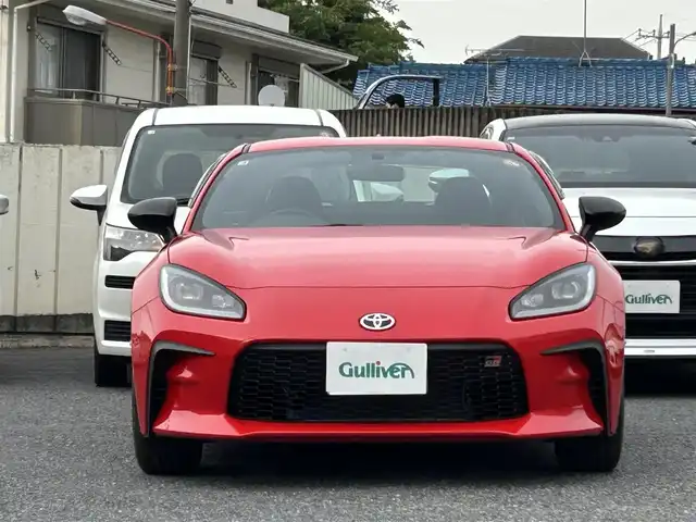 トヨタ ＧＲ８６ SZ 東京都 2025(令7)年 0.1万km 赤 走行距離814km/ワンオーナー/SD純正ナビ【NMZK-W73D】/（AM/FM/CD/DVD/BT/フルセグ）/アイサイトコアテクノロジー/・プリクラッシュブレーキ/・追従機能付きクルーズコントロール/・車線逸脱警報/・先行車発進お知らせ機能/・後退時ブレーキアシスト/バックカメラ/電動リアゲート/ヒルスタートアシスト/GRエンブレム付革巻きステアリングホイール/ETC/ドライブレコーダー/保証書/取扱説明書/スペアキー×1