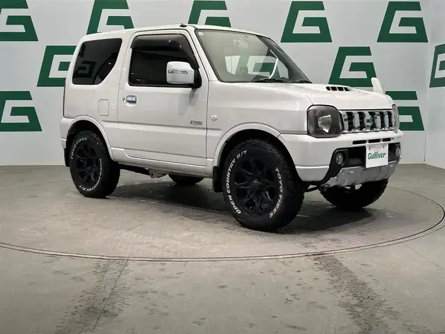スズキ ジムニー クロスアドベンチャー 鹿児島県 2013(平25)年 10.7万km パールホワイト 社外7インチSDナビ【MDV-535DT】/（フルセグTV/CD/DVD/FM/AM/SD）/D席シートヒーター/社外16インチアルミホイール/純正フロアマット/純正HIDヘッドライト/社外前方ドライブレコーダー/社外レーダー探知機/社外ETC/社外テールランプ/禁煙車