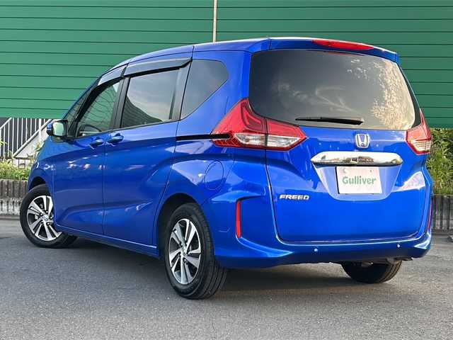 ホンダ フリード G 茨城県 2023(令5)年 1.5万km プレミアムクリスタルブルークリスタル 横滑り防止装置/レーンキープアシスト/オートライト/LEDヘッドライト/サイドエアバッグ/カーテンエアバッグ/衝突被害軽減システム/Bluetooth/USB入力端子/ETC/バックカメラ/フルセグTV/SDナビ/アイドリングストップ/スマートキー/冷房AAC/追従走行付クルーズコントロール/ドライブレコーダー/純正フロアマット/シートヒーター/両側パワースライドドア/15インチ純正アルミホイール
