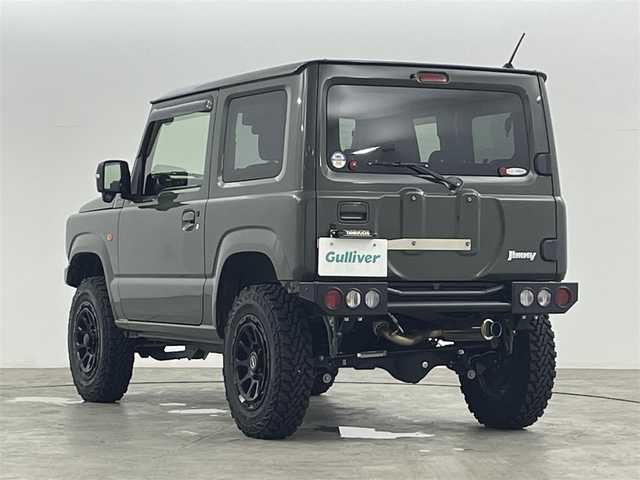 スズキ ジムニー XC 福島県 2019(令1)年 1.7万km ジャングルグリーン スズキセーフティーサポート　/・車線逸脱警報/・フラット警報/・先行車発進告知/・ハイビームアシスト/・標識認識機能/・デュアルセンサーブレーキサポート/社外ナビゲーション/【AM/FM/DVD/CD/Bluetooth/フルセグ】　/型番:KXM-E503W/クルーズコントロール　/パートタイム４ＷＤ　/シートヒーター　/ステアリングスイッチ　/・チルトステアリング/社外リアバンパー　/社外アルミホイール　/プッシュスタート/・スマートキー/LEDライト/・オートライト/サイドアンダーミラー/・社外マフラー
