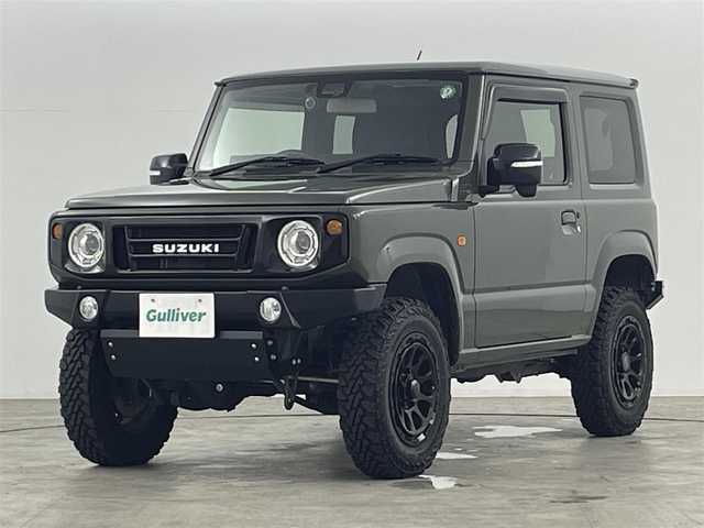 スズキ ジムニー XC 福島県 2019(令1)年 1.7万km ジャングルグリーン スズキセーフティーサポート　/・車線逸脱警報/・フラット警報/・先行車発進告知/・ハイビームアシスト/・標識認識機能/・デュアルセンサーブレーキサポート/社外ナビゲーション/【AM/FM/DVD/CD/Bluetooth/フルセグ】　/型番:KXM-E503W/クルーズコントロール　/パートタイム４ＷＤ　/シートヒーター　/ステアリングスイッチ　/・チルトステアリング/社外リアバンパー　/社外アルミホイール　/プッシュスタート/・スマートキー/LEDライト/・オートライト/サイドアンダーミラー/・社外マフラー