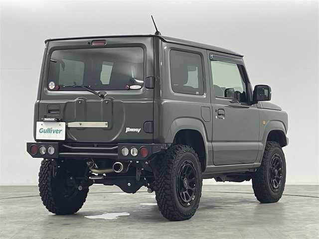 スズキ ジムニー XC 福島県 2019(令1)年 1.7万km ジャングルグリーン スズキセーフティーサポート　/・車線逸脱警報/・フラット警報/・先行車発進告知/・ハイビームアシスト/・標識認識機能/・デュアルセンサーブレーキサポート/社外ナビゲーション/【AM/FM/DVD/CD/Bluetooth/フルセグ】　/型番:KXM-E503W/クルーズコントロール　/パートタイム４ＷＤ　/シートヒーター　/ステアリングスイッチ　/・チルトステアリング/社外リアバンパー　/社外アルミホイール　/プッシュスタート/・スマートキー/LEDライト/・オートライト/サイドアンダーミラー/・社外マフラー