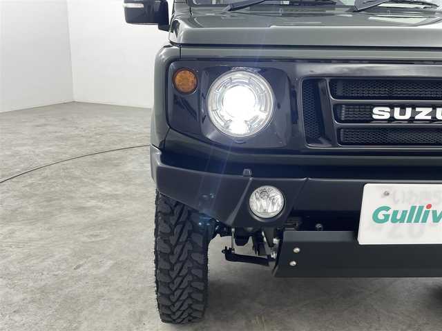 スズキ ジムニー XC 福島県 2019(令1)年 1.7万km ジャングルグリーン スズキセーフティーサポート　/・車線逸脱警報/・フラット警報/・先行車発進告知/・ハイビームアシスト/・標識認識機能/・デュアルセンサーブレーキサポート/社外ナビゲーション/【AM/FM/DVD/CD/Bluetooth/フルセグ】　/型番:KXM-E503W/クルーズコントロール　/パートタイム４ＷＤ　/シートヒーター　/ステアリングスイッチ　/・チルトステアリング/社外リアバンパー　/社外アルミホイール　/プッシュスタート/・スマートキー/LEDライト/・オートライト/サイドアンダーミラー/・社外マフラー