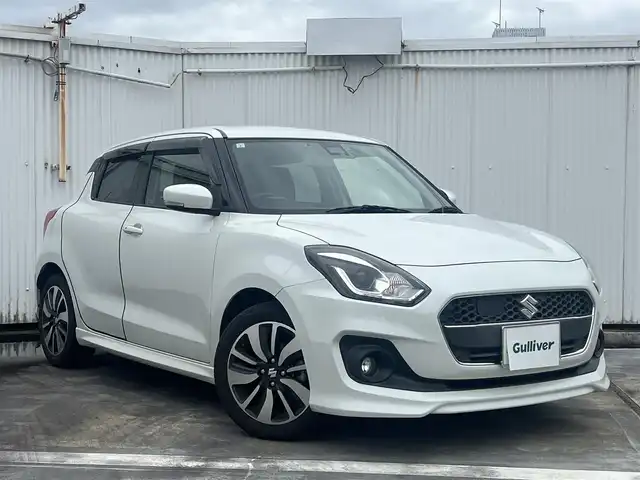 スズキ スイフト RS 広島県 2017(平29)年 6.8万km ピュアホワイトP 走行距離67435km/5速ミッション/純正16インチブラック塗装アルミホイール/ディスプレイオーディオ（ATOTO-S8）/・Bluetooth/・バックカメラ/・Googleマップなど/ドライブレコーダー/ビルトインETC/運転席シートヒーター/セーフティパッケージ/・アダプティブクルーズコントロール/・デュアルセンサーブレーキサポート/・車線逸脱警報機能/・ふらつき警報機能/・先行車発知らせ機能/・ハイビームアシスト機能/・オートライト/スマートキー×2/フロアマット/新車保証書有/取扱説明書有