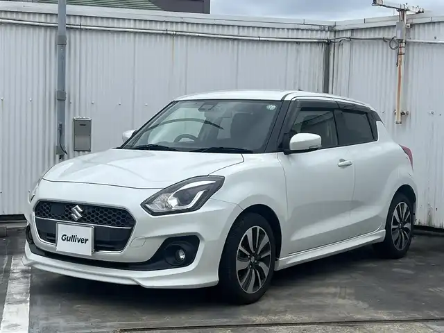 スズキ スイフト RS 広島県 2017(平29)年 6.8万km ピュアホワイトP 走行距離67435km/5速ミッション/純正16インチブラック塗装アルミホイール/ディスプレイオーディオ（ATOTO-S8）/・Bluetooth/・バックカメラ/・Googleマップなど/ドライブレコーダー/ビルトインETC/運転席シートヒーター/セーフティパッケージ/・アダプティブクルーズコントロール/・デュアルセンサーブレーキサポート/・車線逸脱警報機能/・ふらつき警報機能/・先行車発知らせ機能/・ハイビームアシスト機能/・オートライト/スマートキー×2/フロアマット/新車保証書有/取扱説明書有