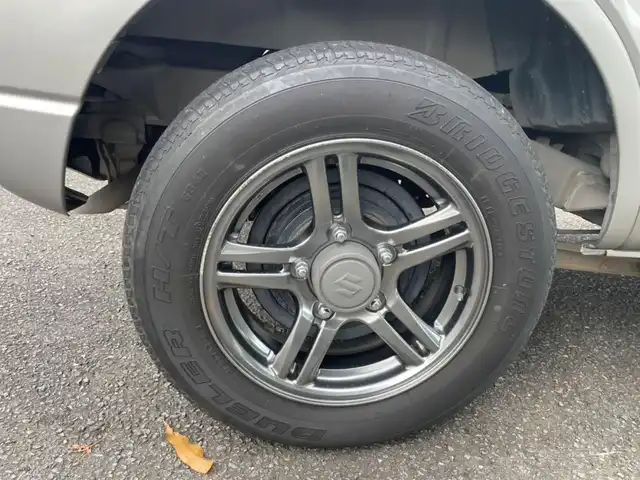 スズキ ジムニー ランドベンチャー 道央・札幌 2014(平26)年 8.7万km スチールシルバーM ワンオーナー/前席シートヒーター/純正メモリナビ/ワンセグTV/CD/純正１６インチアルミホイール/背面タイヤ/ハードカバー/キーレスキー/スペアキー１本/ETC/新車時保証書/取扱説明書