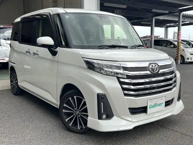 トヨタ ルーミー カスタムG－T 鹿児島県 2022(令4)年 5.5万km パールホワイトⅢ ワンオーナー/純正メモリナビ「NSZT-W68T」/　・DVD・SD・Bluetooth・フルセグTV/パノラミックビューモニター/ビルトインETC/社外前後ドラレコ「コムテック DC-DR652」/純正置くだけ充電/両側パワースライドドア（ウェルカムスイッチあり）/スマートアシスト/　・衝突回避支援ブレーキ/　・車線逸脱警報/　・アダプティブドライビングビーム/　・アダプティブクルーズコントロール/　・コーナーセンサー/純正LEDヘッドライト/純正LEDフォグランプ/オートライト/革巻きステアリング/ステアリングスイッチ/コンフォートパッケージ/　・前席シートヒーター/　・シートバックテーブル/リアサンシェード/純正15インチアルミホイール/電動オート格納ウインカー付ドアミラー/純正フロアマット/純正ドアバイザー/取扱説明書、新車保証書/スペアスマートキーX1本